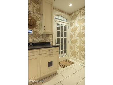 Absolutely magical home overlooking Landfall's largest lake, the on Country Club of Landfall in North Carolina - for sale on GolfHomes.com, golf home, golf lot