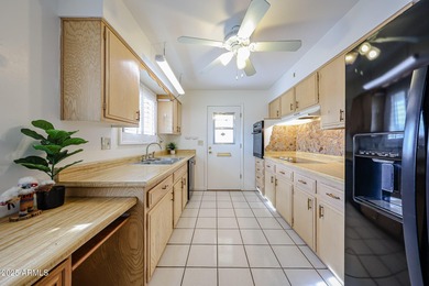 This charming, spacious 2-bedroom, 2-bath home features on Sun City Country Club in Arizona - for sale on GolfHomes.com, golf home, golf lot