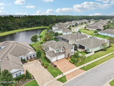 Luxury Living in Palencia, Pond-front Perfection! Welcome to on The Palencia Club in Florida - for sale on GolfHomes.com, golf home, golf lot