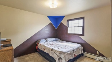 MAIN LEVEL LIVING WITH NEARBY AMENATIES, such as the local golf on Bunker Hill Country Club in Colorado - for sale on GolfHomes.com, golf home, golf lot