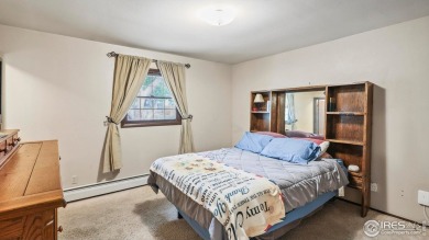 MAIN LEVEL LIVING WITH NEARBY AMENATIES, such as the local golf on Bunker Hill Country Club in Colorado - for sale on GolfHomes.com, golf home, golf lot