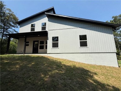 Be the first to own this beautifully designed modern home on the on  in Arkansas - for sale on GolfHomes.com, golf home, golf lot