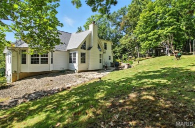 WOW! This beautifully built home on the 13th hole of Raintree on Raintree Country Club in Missouri - for sale on GolfHomes.com, golf home, golf lot