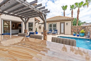 Welcome to this beautifully crafted Estaurio courtyard home by on Jacksonville Golf and Country Club in Florida - for sale on GolfHomes.com, golf home, golf lot