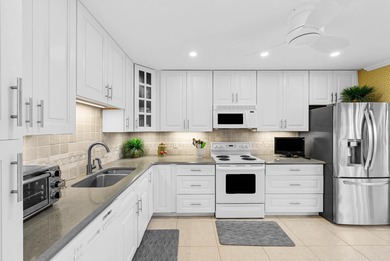 Exceptional lake and golf course views from this spacious on Quail Ridge Golf Course and Country Club in Florida - for sale on GolfHomes.com, golf home, golf lot