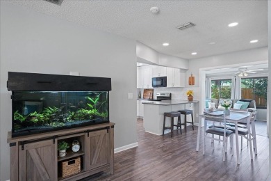 Step into this thoughtfully updated 3-bedroom, 2-bathroom home on Cove Cay Country Club in Florida - for sale on GolfHomes.com, golf home, golf lot