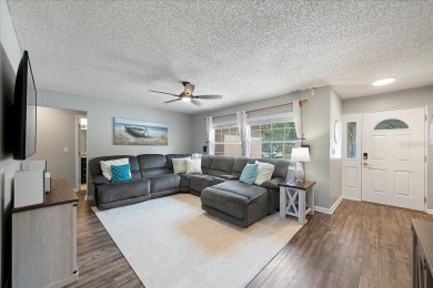 Step into this thoughtfully updated 3-bedroom, 2-bathroom home on Cove Cay Country Club in Florida - for sale on GolfHomes.com, golf home, golf lot