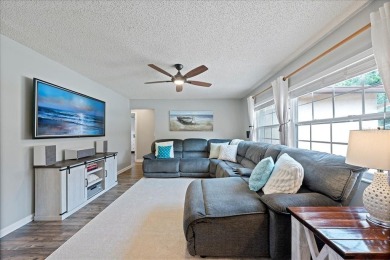 Step into this thoughtfully updated 3-bedroom, 2-bathroom home on Cove Cay Country Club in Florida - for sale on GolfHomes.com, golf home, golf lot