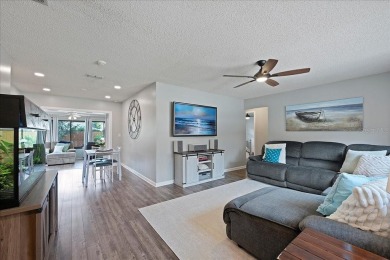 Step into this thoughtfully updated 3-bedroom, 2-bathroom home on Cove Cay Country Club in Florida - for sale on GolfHomes.com, golf home, golf lot