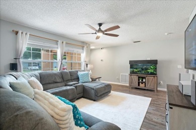 Step into this thoughtfully updated 3-bedroom, 2-bathroom home on Cove Cay Country Club in Florida - for sale on GolfHomes.com, golf home, golf lot