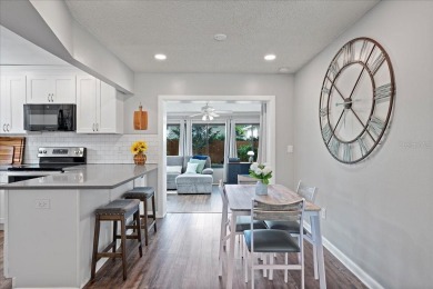 Step into this thoughtfully updated 3-bedroom, 2-bathroom home on Cove Cay Country Club in Florida - for sale on GolfHomes.com, golf home, golf lot