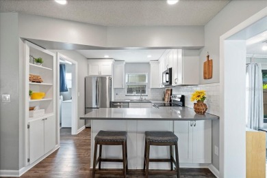 Step into this thoughtfully updated 3-bedroom, 2-bathroom home on Cove Cay Country Club in Florida - for sale on GolfHomes.com, golf home, golf lot