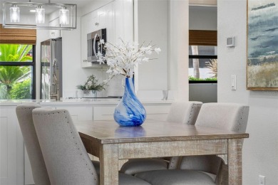 LUXURY WATERFRONT LIVING--DESIGNER FINISHES, POOL, SUNSET AND on Isla Del Sol Yacht and Country Club in Florida - for sale on GolfHomes.com, golf home, golf lot
