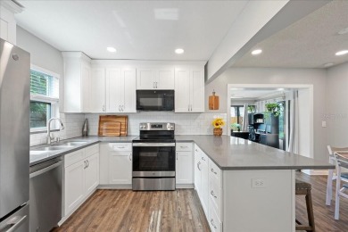 Step into this thoughtfully updated 3-bedroom, 2-bathroom home on Cove Cay Country Club in Florida - for sale on GolfHomes.com, golf home, golf lot