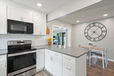 Step into this thoughtfully updated 3-bedroom, 2-bathroom home on Cove Cay Country Club in Florida - for sale on GolfHomes.com, golf home, golf lot