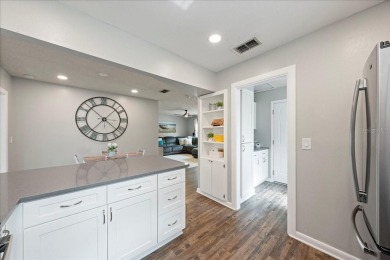 Step into this thoughtfully updated 3-bedroom, 2-bathroom home on Cove Cay Country Club in Florida - for sale on GolfHomes.com, golf home, golf lot