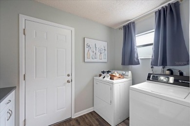 Step into this thoughtfully updated 3-bedroom, 2-bathroom home on Cove Cay Country Club in Florida - for sale on GolfHomes.com, golf home, golf lot