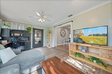 Step into this thoughtfully updated 3-bedroom, 2-bathroom home on Cove Cay Country Club in Florida - for sale on GolfHomes.com, golf home, golf lot
