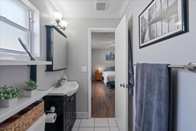 Step into this thoughtfully updated 3-bedroom, 2-bathroom home on Cove Cay Country Club in Florida - for sale on GolfHomes.com, golf home, golf lot