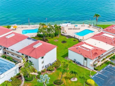 LUXURY WATERFRONT LIVING--DESIGNER FINISHES, POOL, SUNSET AND on Isla Del Sol Yacht and Country Club in Florida - for sale on GolfHomes.com, golf home, golf lot