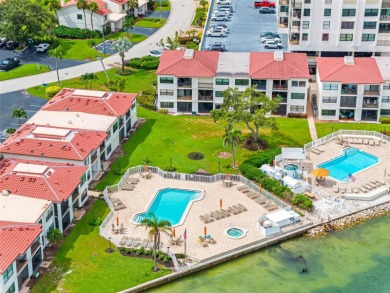 LUXURY WATERFRONT LIVING--DESIGNER FINISHES, POOL, SUNSET AND on Isla Del Sol Yacht and Country Club in Florida - for sale on GolfHomes.com, golf home, golf lot