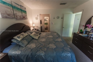 This stunning condo villa features two spacious master bedrooms on Fontainebleau Golf Course in Florida - for sale on GolfHomes.com, golf home, golf lot