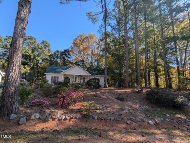 Welcome to your home. Discover this comfortable and cozy Ranch on River Golf and County Club at Lake Royale in North Carolina - for sale on GolfHomes.com, golf home, golf lot