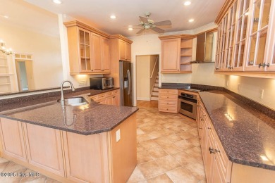 Proudly presenting this low-maintenance brick home located on on Ocean Ridge Plantation in North Carolina - for sale on GolfHomes.com, golf home, golf lot