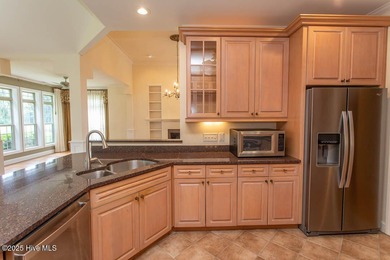 Proudly presenting this low-maintenance brick home located on on Ocean Ridge Plantation in North Carolina - for sale on GolfHomes.com, golf home, golf lot