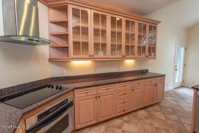 Proudly presenting this low-maintenance brick home located on on Ocean Ridge Plantation in North Carolina - for sale on GolfHomes.com, golf home, golf lot
