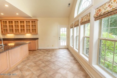 Proudly presenting this low-maintenance brick home located on on Ocean Ridge Plantation in North Carolina - for sale on GolfHomes.com, golf home, golf lot