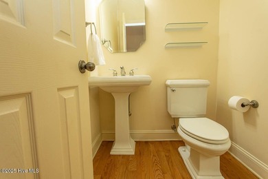 Proudly presenting this low-maintenance brick home located on on Ocean Ridge Plantation in North Carolina - for sale on GolfHomes.com, golf home, golf lot