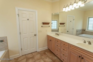 Proudly presenting this low-maintenance brick home located on on Ocean Ridge Plantation in North Carolina - for sale on GolfHomes.com, golf home, golf lot