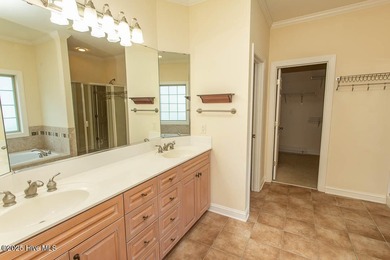 Proudly presenting this low-maintenance brick home located on on Ocean Ridge Plantation in North Carolina - for sale on GolfHomes.com, golf home, golf lot