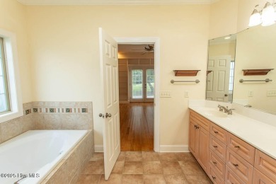 Proudly presenting this low-maintenance brick home located on on Ocean Ridge Plantation in North Carolina - for sale on GolfHomes.com, golf home, golf lot