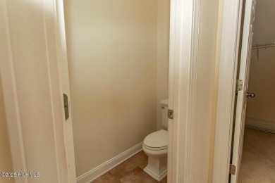 Proudly presenting this low-maintenance brick home located on on Ocean Ridge Plantation in North Carolina - for sale on GolfHomes.com, golf home, golf lot