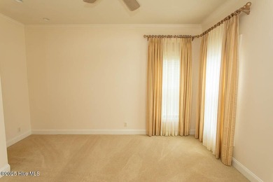 Proudly presenting this low-maintenance brick home located on on Ocean Ridge Plantation in North Carolina - for sale on GolfHomes.com, golf home, golf lot