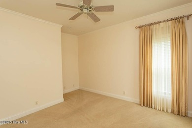 Proudly presenting this low-maintenance brick home located on on Ocean Ridge Plantation in North Carolina - for sale on GolfHomes.com, golf home, golf lot