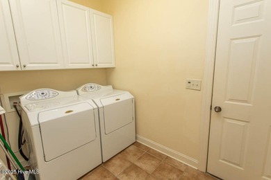 Proudly presenting this low-maintenance brick home located on on Ocean Ridge Plantation in North Carolina - for sale on GolfHomes.com, golf home, golf lot