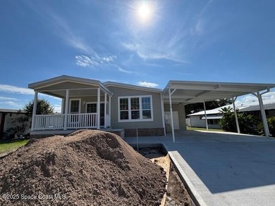 Brand-New 2026 Model Home in Barefoot Bay! Step into modern on Barefoot Bay Golf Course in Florida - for sale on GolfHomes.com, golf home, golf lot