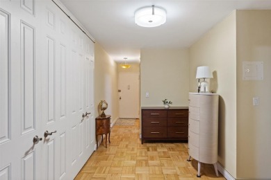 Enter through a welcoming foyer into a large living room on Leewood Golf Club in New York - for sale on GolfHomes.com, golf home, golf lot