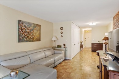 Enter through a welcoming foyer into a large living room on Leewood Golf Club in New York - for sale on GolfHomes.com, golf home, golf lot