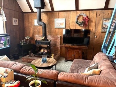 Your Forest Retreat: Enchanting Chalet in The Hideout 3 Bedrooms on The Hideout Golf in Pennsylvania - for sale on GolfHomes.com, golf home, golf lot