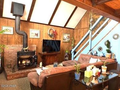 Your Forest Retreat: Enchanting Chalet in The Hideout 3 Bedrooms on The Hideout Golf in Pennsylvania - for sale on GolfHomes.com, golf home, golf lot