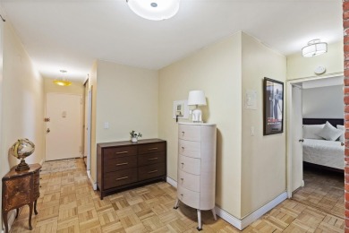 Enter through a welcoming foyer into a large living room on Leewood Golf Club in New York - for sale on GolfHomes.com, golf home, golf lot