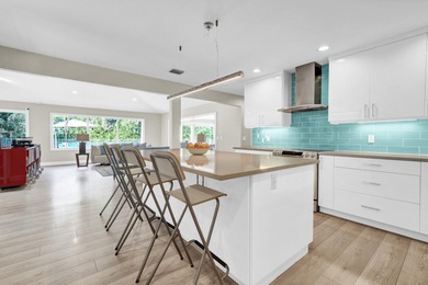 Situated on a nearly half-acre, fully fenced lot in a quiet on Pine Tree Golf Club in Florida - for sale on GolfHomes.com, golf home, golf lot