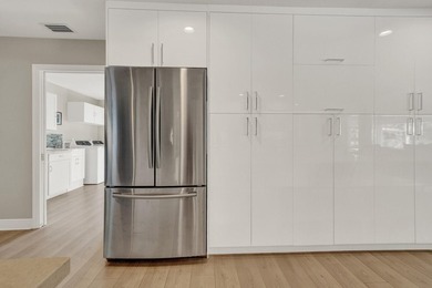 Situated on a nearly half-acre, fully fenced lot in a quiet on Pine Tree Golf Club in Florida - for sale on GolfHomes.com, golf home, golf lot