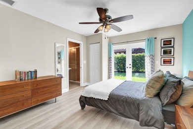 Situated on a nearly half-acre, fully fenced lot in a quiet on Pine Tree Golf Club in Florida - for sale on GolfHomes.com, golf home, golf lot