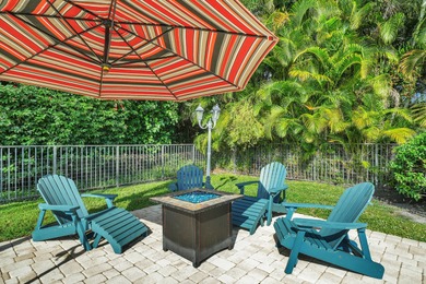 Situated on a nearly half-acre, fully fenced lot in a quiet on Pine Tree Golf Club in Florida - for sale on GolfHomes.com, golf home, golf lot