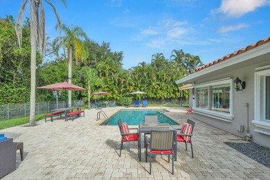 Situated on a nearly half-acre, fully fenced lot in a quiet on Pine Tree Golf Club in Florida - for sale on GolfHomes.com, golf home, golf lot